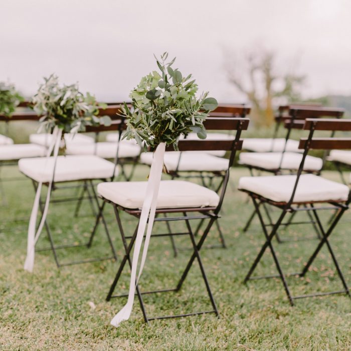 wedding decoration chairs in rustic green style. Wedding in Italy. fine art wedding photo.